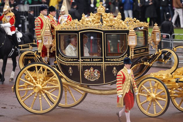King Charles III and Camilla, Queen Consort travelling in the Diamond Jubilee Coach built in 2012 to commemorate the 60th anniversary of the reign of Queen Elizabeth II.