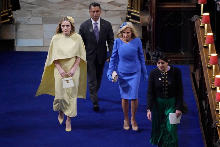 First lady Jill Biden and her granddaughter Finnegan Biden arrive at Westminster Abbey on Saturday ahead of the coronations of King Charles III and Queen Camilla.