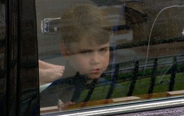 Prince Louis arrives at his grandfather's coronation looking serious.