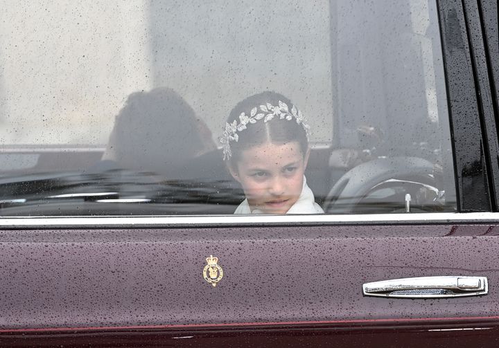 Princess Charlotte of Wales traveling in the state car to the coronation of King Charles III and Queen Camilla on Saturday.