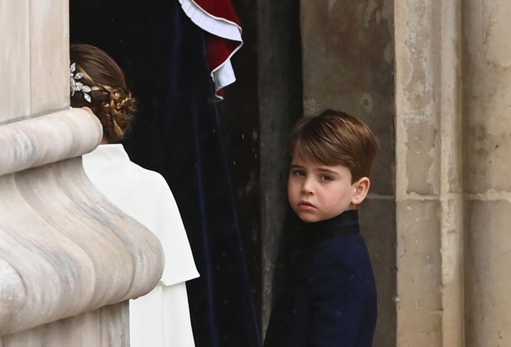 Louis enters Westminster Abbey.