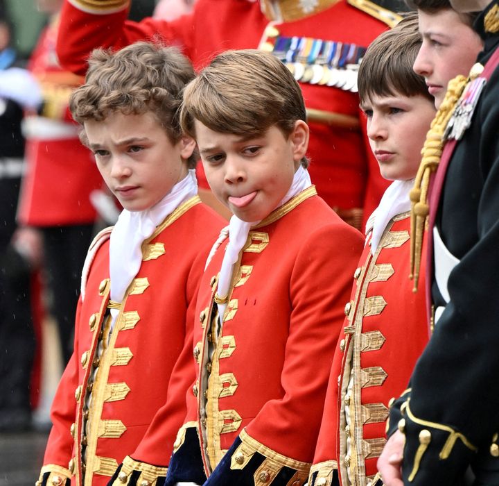 Prince George reacts as he waits for the ceremony to end. 