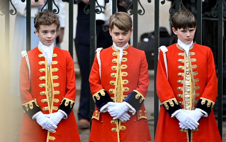 George of Wales (center) stands at Westminster Abbey ahead of the coronations of Charles and Camilla.