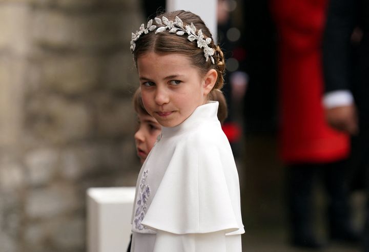 Princess Charlotte escorts Prince Louis into Westminster Abbey.