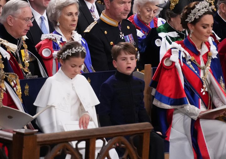 Prince Louis looks like he's struggling to concentrate as the service continues on.