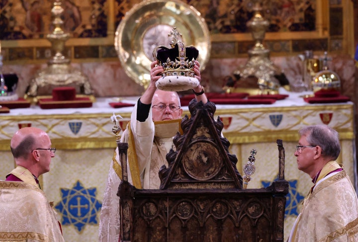 The Archbishop of Canterbury Justin Welby places the St Edward's Crown onto the head of King Charles III. 