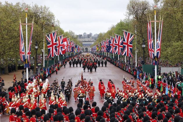 The military procession makes its way down The Mall towards Buckingham Palace.