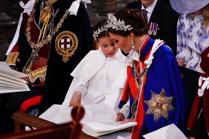 Princess Charlotte and her mother share a sweet moment during the ceremony. 