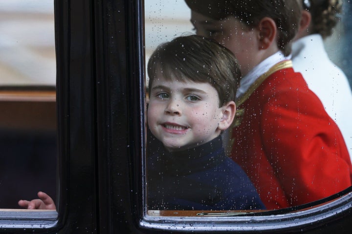 Louis smiles through the window as he travels with his family back to Buckingham Palace from Westminster Abbey on May 6.