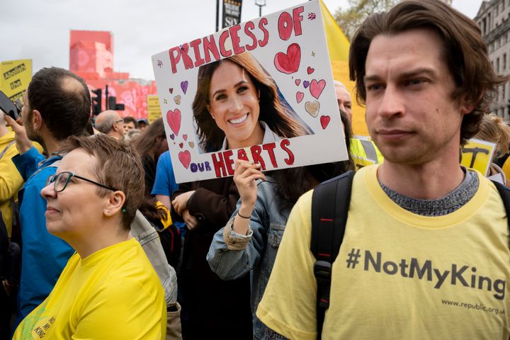 A member of the anti-monarchist group 'Republic' protest in Trafalgar Square with an image of Meghan, Duchess of Sussex.