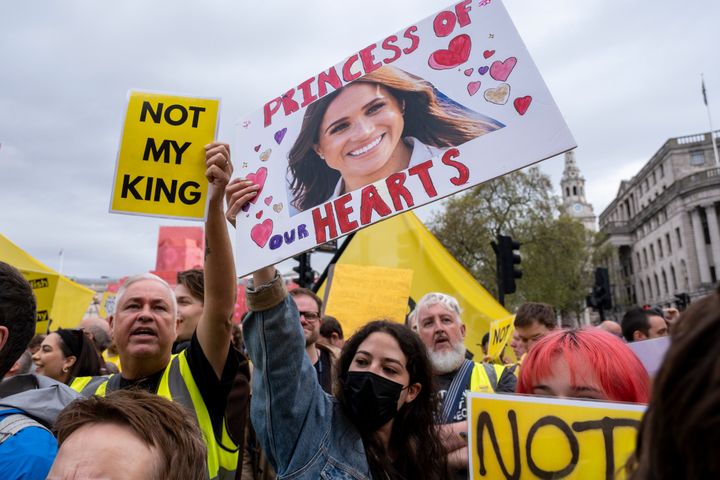 A poster of Meghan Markle, with the words "princess of our hearts," is displayed as people protest King Charles' coronation in London on Friday, May 6.