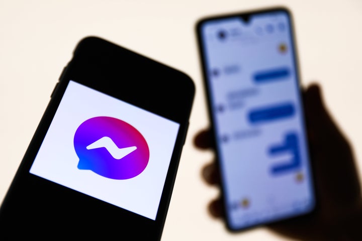 Messenger logo displayed on a phone screen and conversation on the Messenger displayed on a phone screen in the background are seen in this illustration photo taken in Krakow, Poland on August 27, 2021. (Photo Illustration by Jakub Porzycki/NurPhoto via Getty Images)