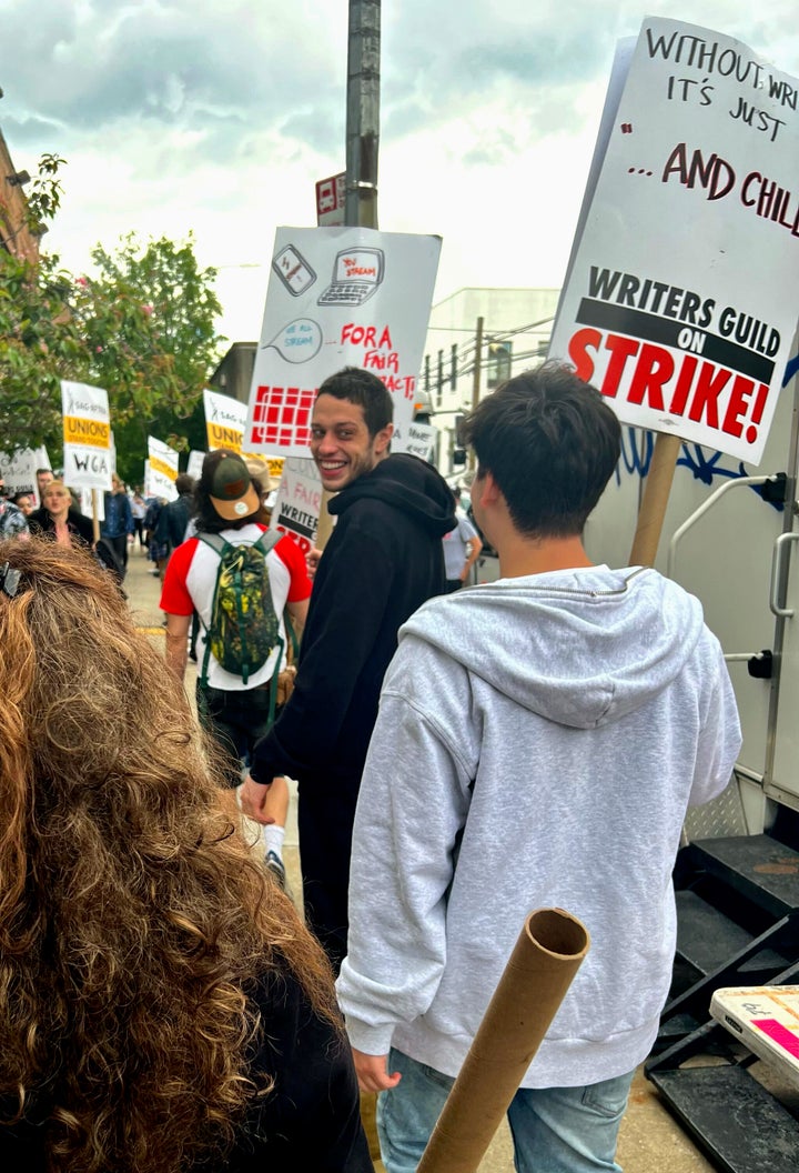 Pete Davidson pickets on Friday in New York City. Writers Guild of America members have gone on strike in a contract dispute with studios and streaming services over lowering wages, residuals and the future of AI in entertainment.