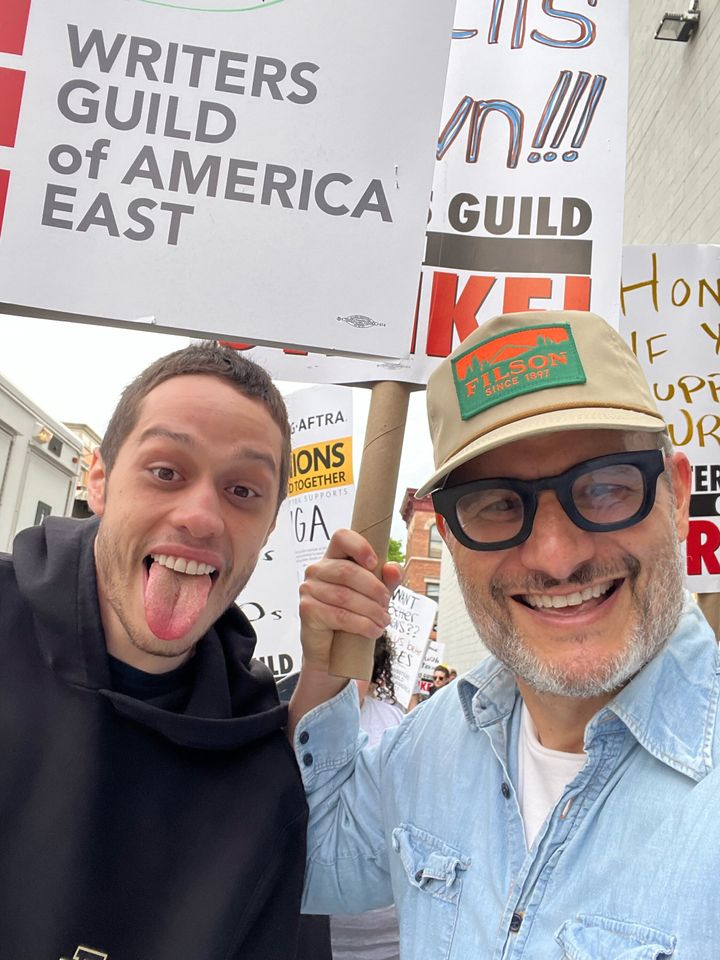 Pete Davidson and Judah Miller join members of the Writers Guild of America and its supporters to picket on Friday in New York City.