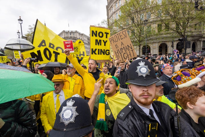 People protest the British monarchy in London on the weekend of King Charles' coronation.