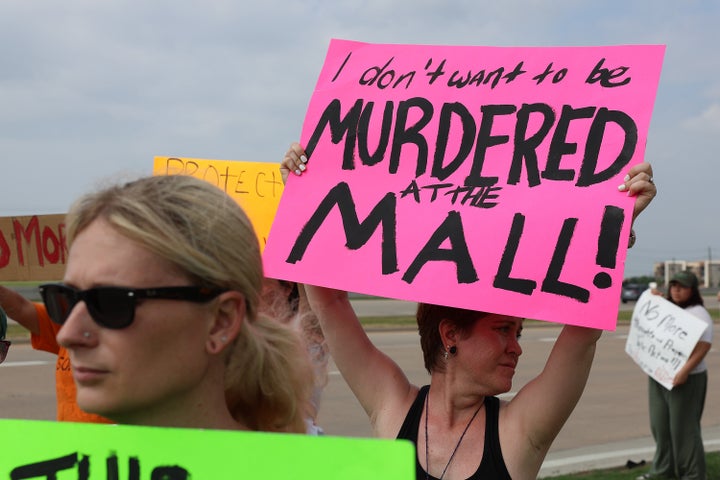 ALLEN, TEXAS - MAY 07: People protest against gun violence outside of the Cotton wood Creek Baptist Church on May 7, 2023 in Allen, Texas.