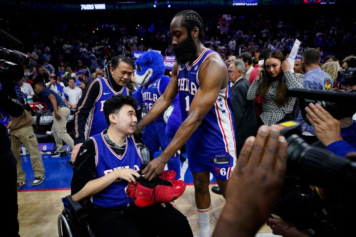 Philadelphia 76ers star James Harden gives his sneakers to John Hao after game four of a second round playoff series on Sunday. Harden invited Hao, a student severely wounded in a Feb. 13 mass shooting at Michigan State University, to view the game.