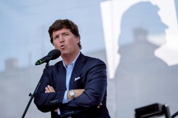 FILE: Tucker Carlson speaks in Esztergom, Hungary in 2021. Carlson is not willing to shy away from the media world as his friend told Axios that the Fox host “wants his freedom.”