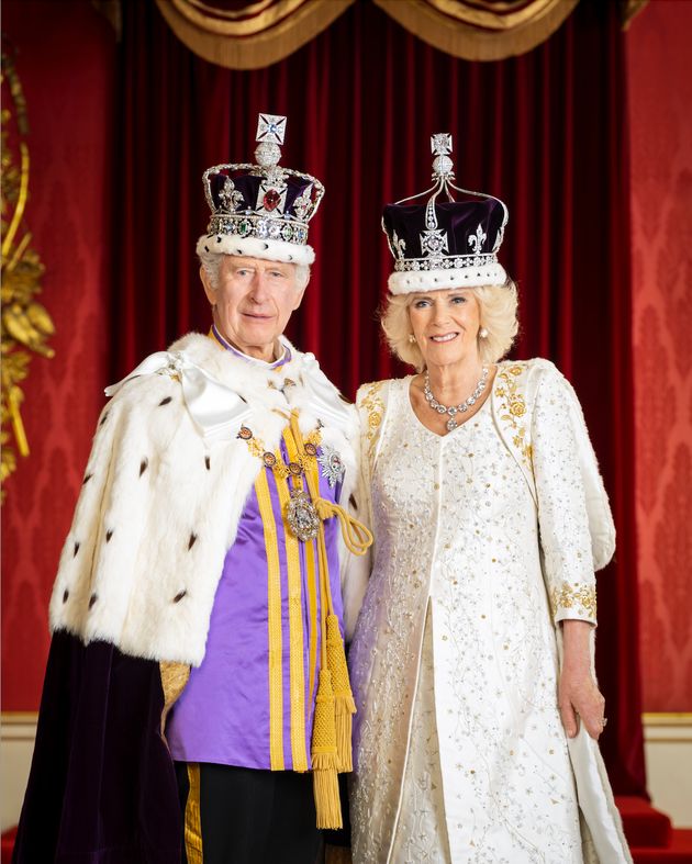 The king and queen are pictured in the Throne Room at Buckingham Palace.
