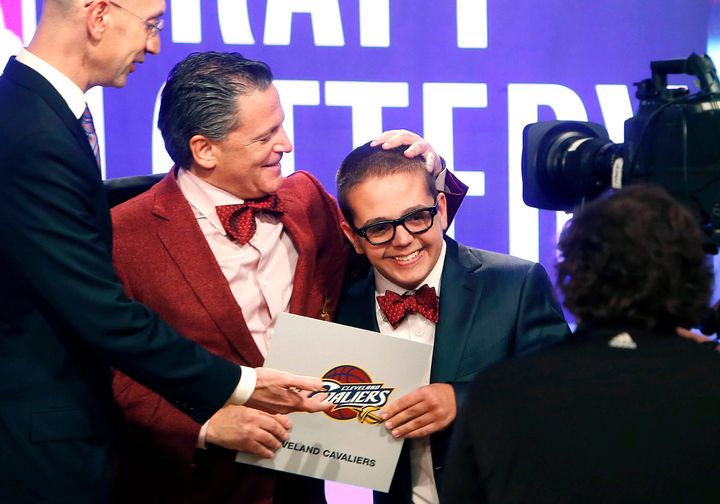 Cleveland Cavaliers owner Dan Gilbert congratulates his son, Nick Gilbert, after the team won the 2013 NBA basketball draft lottery in New York.