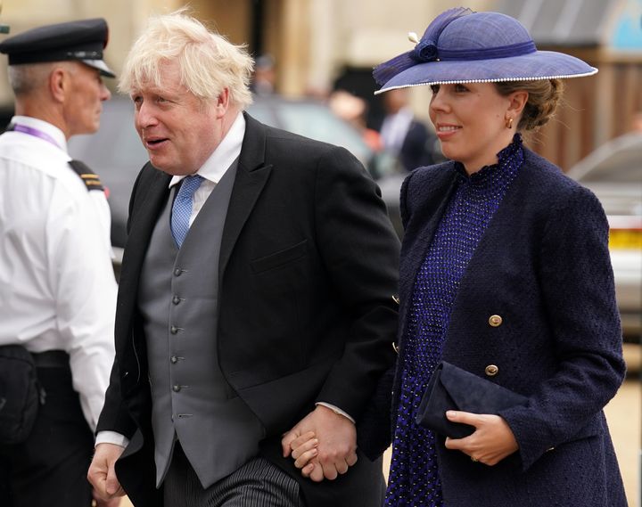 Former prime minister Boris Johnson and his wife Carrie Johnson arrive at the Coronation of King Charles III and Queen Camilla on May 6, 2023 in London.