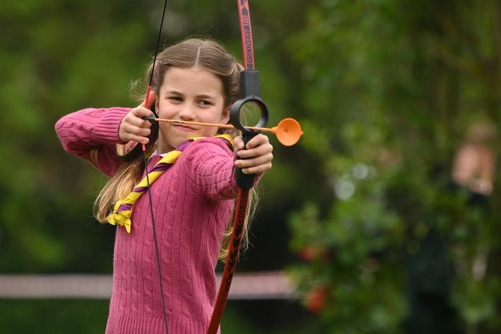 Princess Charlotte tries her hand at archery while taking part in the Big Help Out.