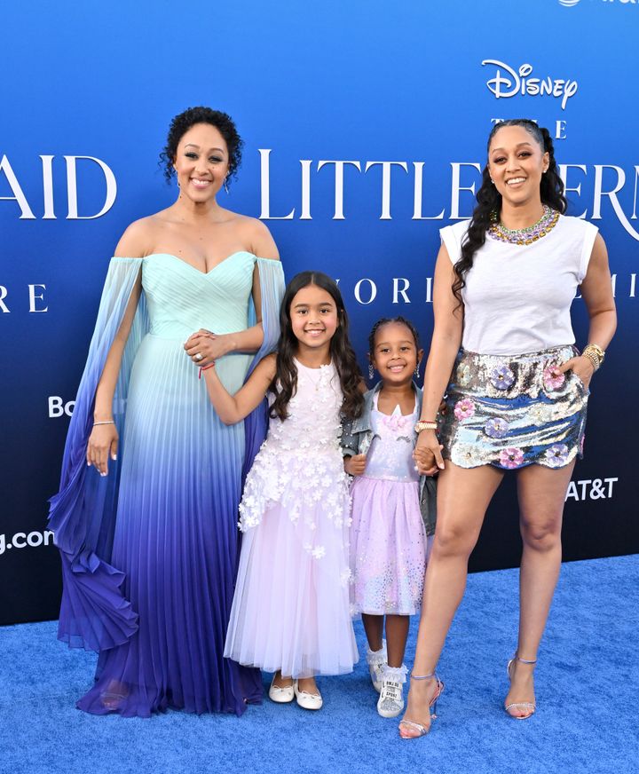 Tamera Mowry-Housley with her daughter, Ariah, and Tia Mowry with her daughter, Cairo, attend the world premiere of Disney's live-action "Little Mermaid."