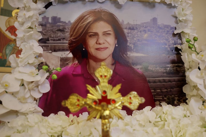 A portrait of slain Al-Jazeera journalist Shireen Abu Akleh is framed with flowers ahead of the first anniversary of her death on May 7, 2023.