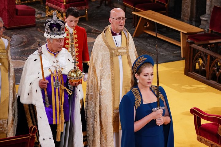 Lord President of the Council, Penny Mordaunt, holding the Sword of State walking ahead of King Charles III during the Coronation of King Charles III and Queen Camilla on May 6, 2023.