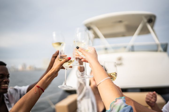 Friends making a toast during a yacht party