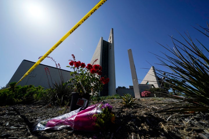 FILE - Flowers sit near crime scene tape at Geneva Presbyterian Church, Tuesday, May 17, 2022, in Laguna Woods, Calif., after a fatal shooting at the church.
