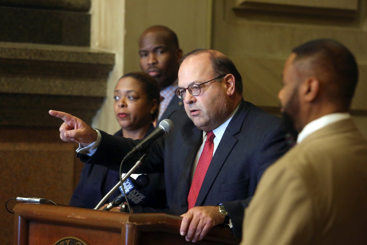 Then-City Council member Allan Domb, center, addresses the media in 2017. A self-made real-estate magnate, he has used his wealth to pitch voters on his tough-on-crime agenda.