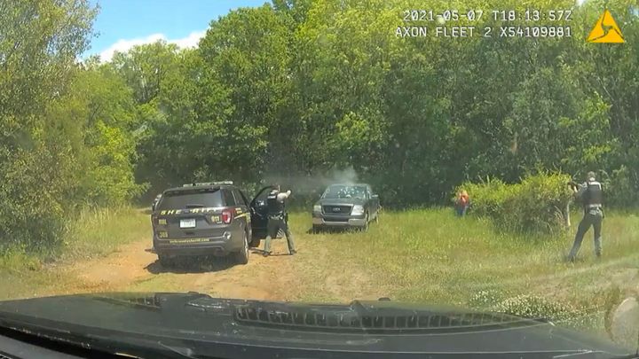 This image provided by York County Sheriff's Office and released by attorney Justim Bamberg shows police dash cam video of Trevor Mullinax's encounter with York County deputies in May 2021. Mullinax is suing the sheriff's office in South Carolina saying deputies shot at him about 50 times when he was having a mental health crisis in a parked truck with a shotgun in his lap, even though he says his hands were raised. (York County Sheriff's Office via AP)