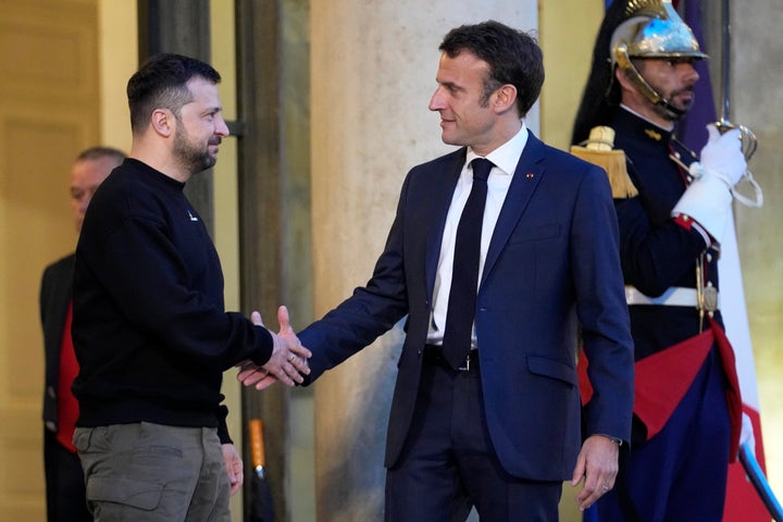 French President Emmanuel Macron, right, welcomes Ukrainian President Volodymyr Zelenskyy at the Elysee palace in Paris, on May 14, 2023. 