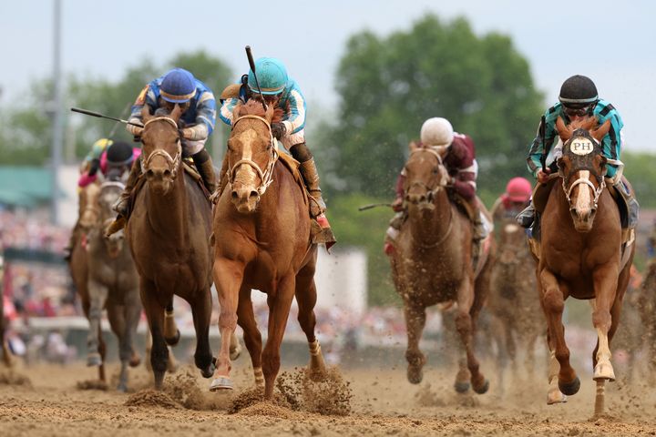 Mage #8, ridden by jockey Javier Castellano, crosses the finish line to win the 149th running of the Kentucky Derby at Churchill Downs on May 6, 2023, in Louisville, Kentucky.