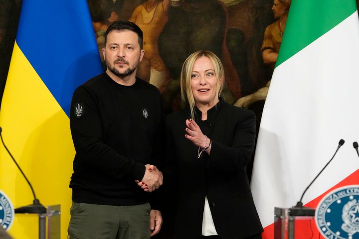 Ukrainian President Volodymyr Zelenskyy, left, and Italian Premier Giorgia Meloni shake hands during a press conference after their meeting at Chigi Palace, Government's office, in Rome, on May 13, 2023.