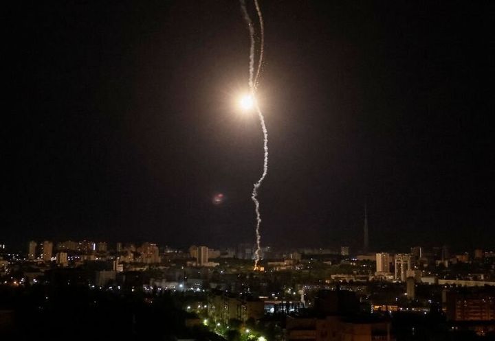 Explosion of a missile is seen in the sky over the city during a Russian missile strike in Kyiv, Ukraine May 16, 2023.