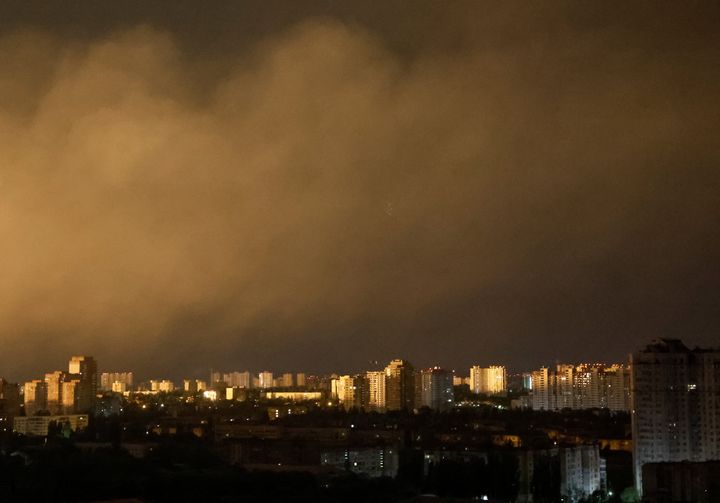 A flash from the explosion of a missile illuminates the city during a Russian missile strike, amid Russia's attack on Ukraine, in Kyiv, Ukraine May 16, 2023. 