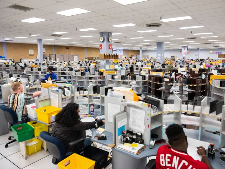IRS employees work at a processing facility in Austin, Texas, in June 2022.