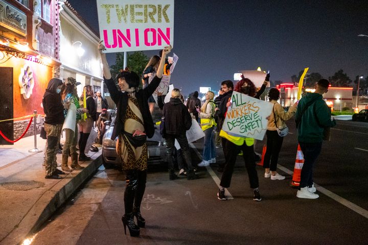 Reagan, a dancer, protests outside Star Garden Topless Dive Bar on March 26, 2022, in North Hollywood, California.