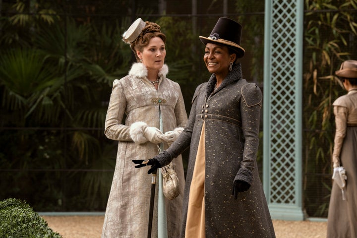 Ruth Gemmell as Violet Bridgerton and Adjoa Andoh as Lady Agatha Danbury in Queen Charlotte: A Bridgerton Story.