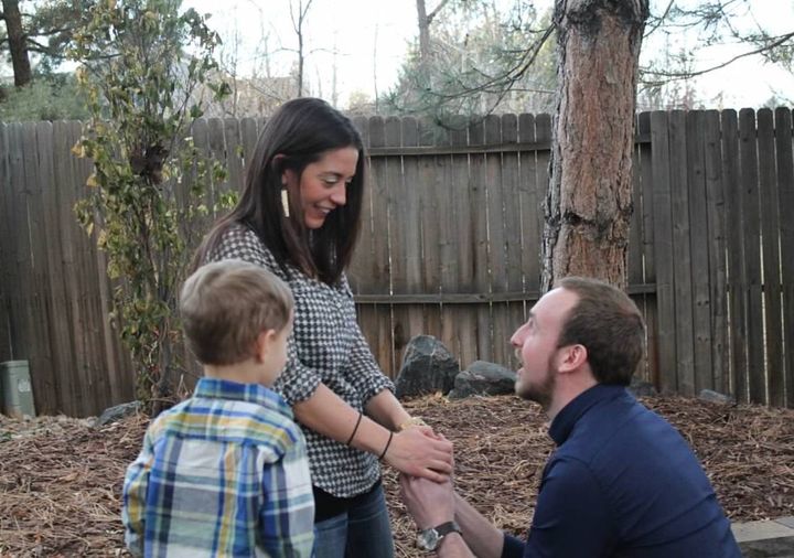 The author on Thanksgiving Day in 2014, two days after her stage 4 diagnosis, as her then-boyfriend Nick proposed. “My nephew photobombed the proposal,” she writes.