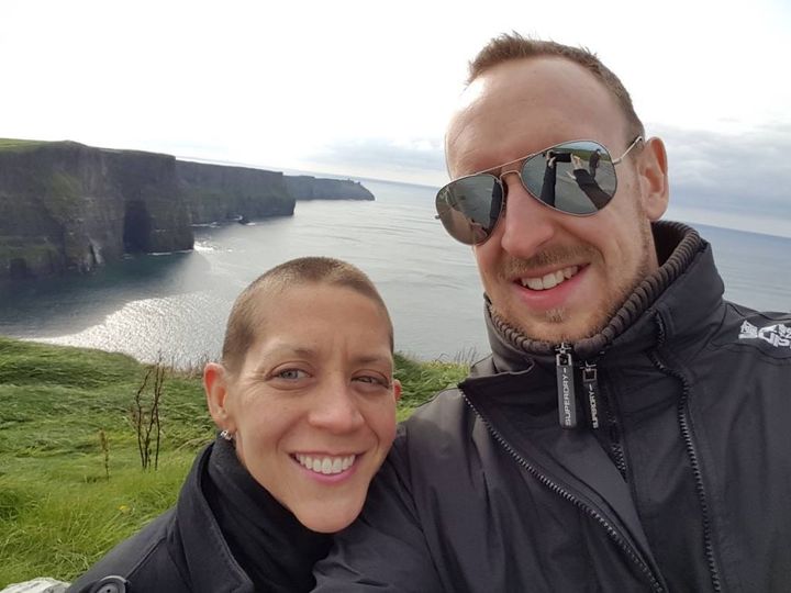 The author visiting her “happy place,” the Cliffs of Moher in Ireland, with Nick in 2016 after her third clinical trial.