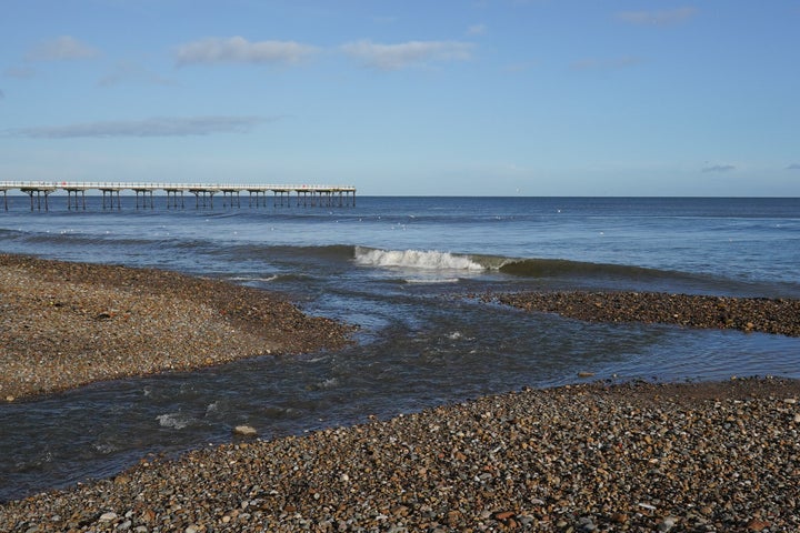 A ruptured sewage pipe spills waste into a stream last February, in Saltburn-by-the-Sea, England.