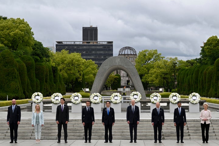 G7 leaders, from left to right, European Council President Charles Michel, Italian Prime Minister Giorgia Meloni, Canadian Prime Minister Justin Trudeau, French President Emmanuel Macron, Japan's Prime Minister Fumio Kishida, U.S. President Joe Biden, German Chancellor Olaf Scholz, British Prime Minister Rishi Sunak, and European Commission President Ursula von der Leyen pose for a group photo, after laying a wreath, at the Peace Memorial Park during a visit as part of the G7 Summit in Hiroshima, western Japan, on May 19, 2023. 