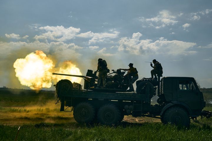 Ukrainian soldiers fire a cannon near Bakhmut, an eastern city where fierce battles against Russian forces have been taking place, in the Donetsk region, Ukraine, May 15, 2023. 