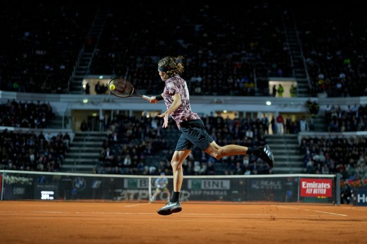 Stefanos Tsitsipas of Greece returns the ball to Borna Coric of Croatia, during a quarterfinal match at the Italian Open tennis tournament, in Rome, Thursday, May 18, 2023. (AP Photo/Andrew Medichini)