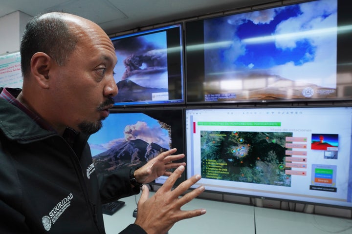 FILE - Paulino Alonso Rivera, who works at Mexico's National Disaster Reduction Center, gives an interview as he monitors the Popocatépetl volcano, in Mexico City, February 8, 2023.