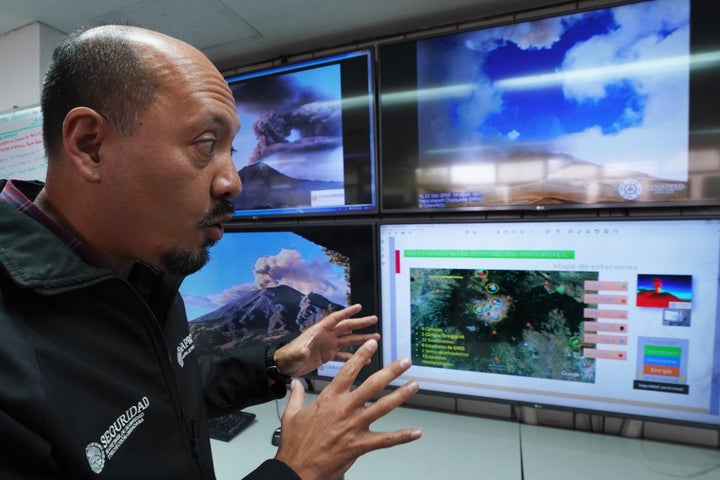 FILE - Paulino Alonso Rivera, who works at the National Center for Disaster Prevention of Mexico, gives an interview as he monitors the Popocatépetl volcano, in Mexico City, Feb. 8, 2023.