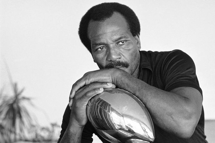 FILE - Jim Brown, who set the National Football League rushing record of 12,312 yards while playing for the Cleveland Browns, sits pensively in his home, Tuesday, Sept. 19, 1984, Los Angeles, Calif. NFL legend, actor and social activist Jim Brown passed away peacefully in his Los Angeles home on Thursday night, May 18, 2023, with his wife, Monique, by his side, according to a spokeswoman for Brown's family. He was 87. (AP Photo/Lennox McLendon, File)